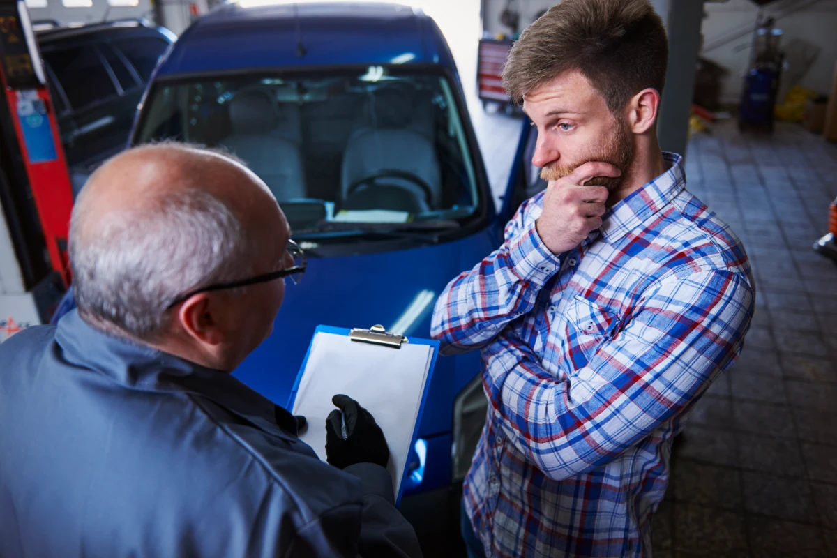 A customer talking with a transportation expert about vehicle import regulations